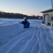 ATV Plow Pushing Snow